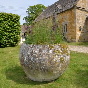 An 18th century large circular stone trough