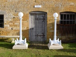 A large pair of 19th century cast iron lamp stands 