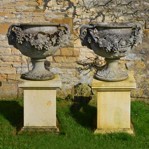 A pair of Austin & Seeley artificial stone urns known as the ‘Adelaide Vase’