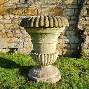 A large Cotswold Stone campana shaped planter