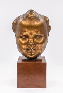 A gilt bronze baby portrait of Kirston Henderson 