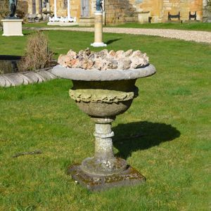 A late 19th century carved stone urn of campana form