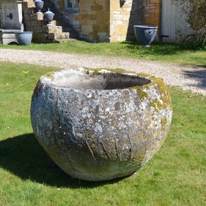 An 18th century large circular stone trough
