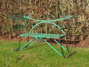 A vintage painted iron strapwork garden seat 