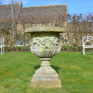 A large mid 19th century carved stone urn 