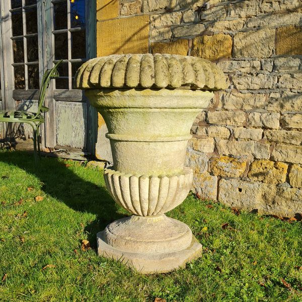 A large Cotswold Stone campana shaped planter