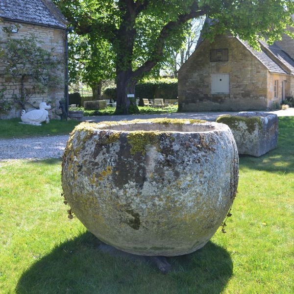 An 18th century large circular stone trough