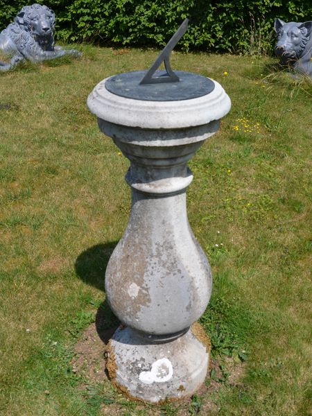 A Portland stone sundial pedestal with Negretti and Zambra dial Plate