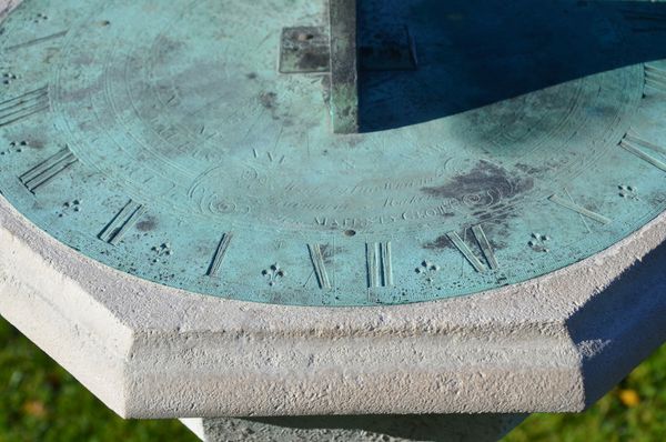 An 18th century Portland stone sundial pedestal with brass dial plate by Thomas Wright  (1711-1786)