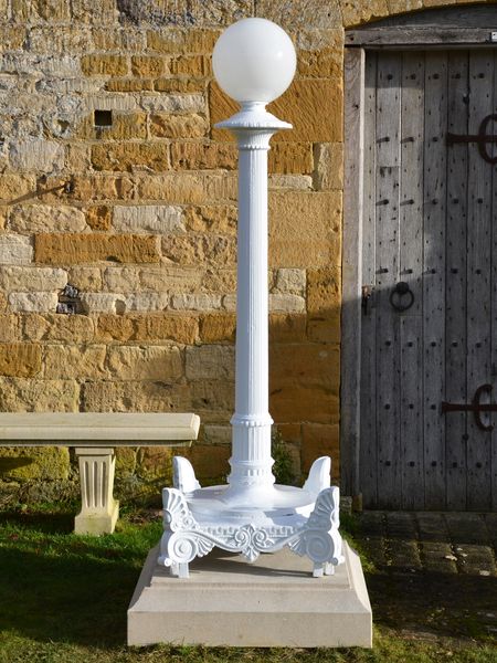 A large pair of 19th century cast iron lamp stands 