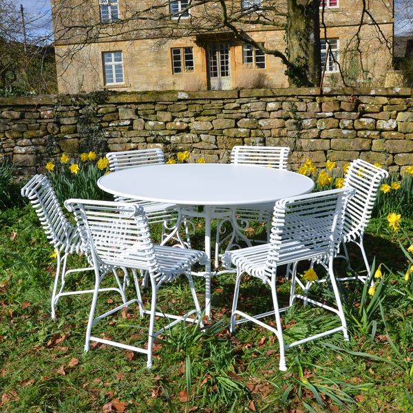 The Large Circular Garden Dining Table with Six Ladderback Garden Chairs