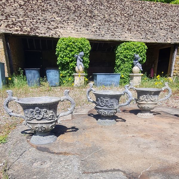 A large pair of lead urns (4 pairs available)