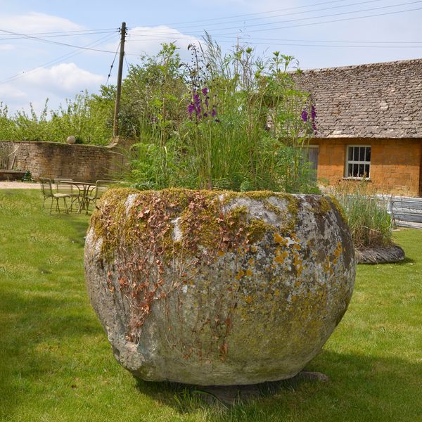 An 18th century large circular stone trough