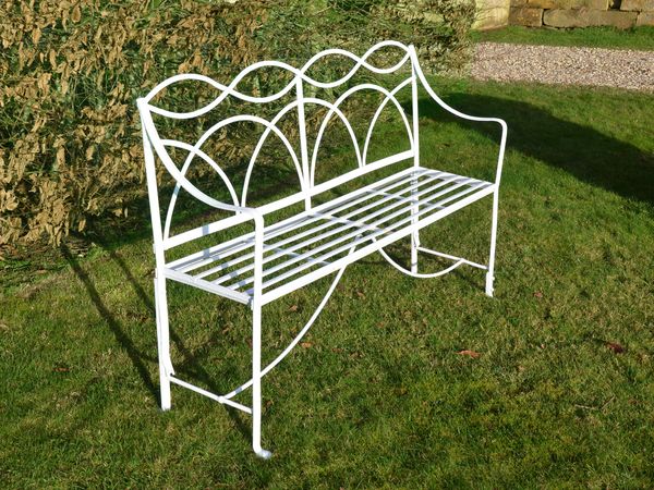 A Regency wrought iron garden seat