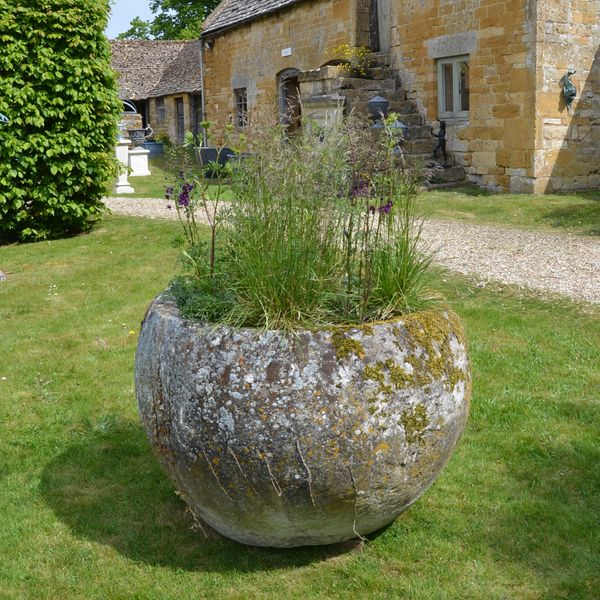 An 18th century large circular stone trough