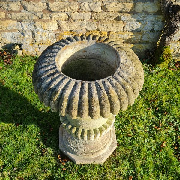 A large Cotswold Stone campana shaped planter