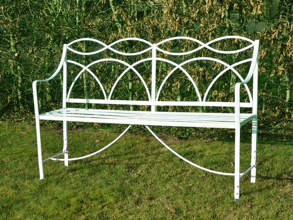 A Regency wrought iron garden seat