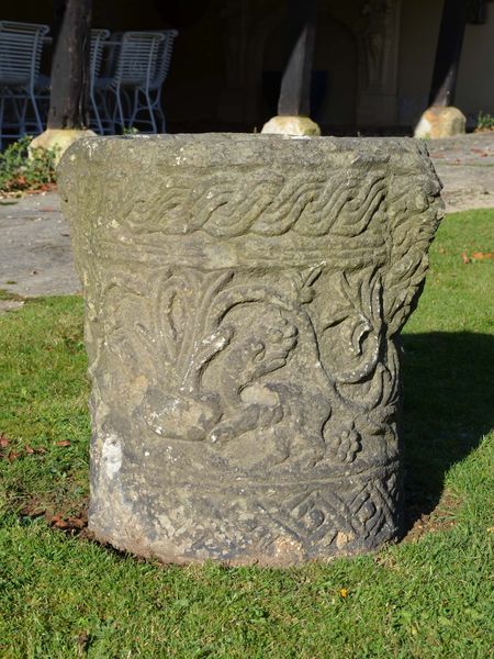 A Romanesque style carved stone planter 