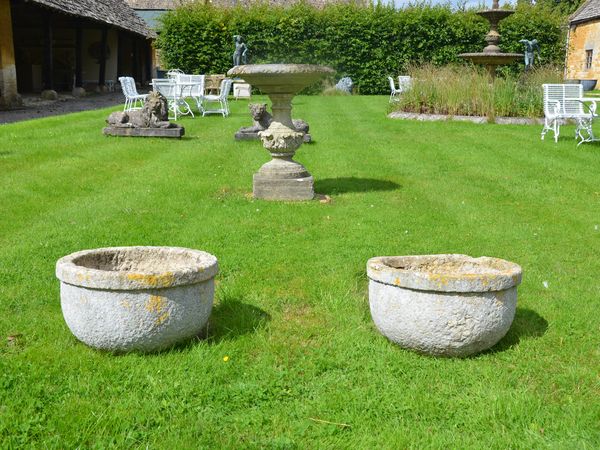 A pair of 19th century circular stone garden planters