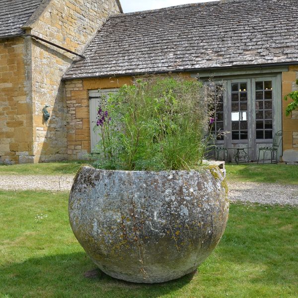 An 18th century large circular stone trough