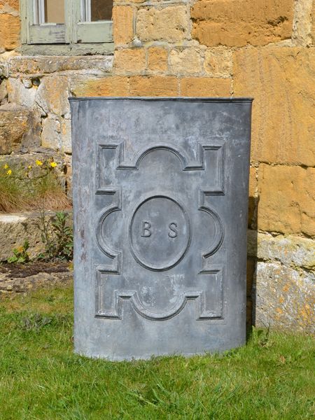 An 18th century lead corner cistern of triangular form