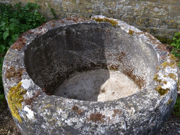 An 18th century circular stone trough