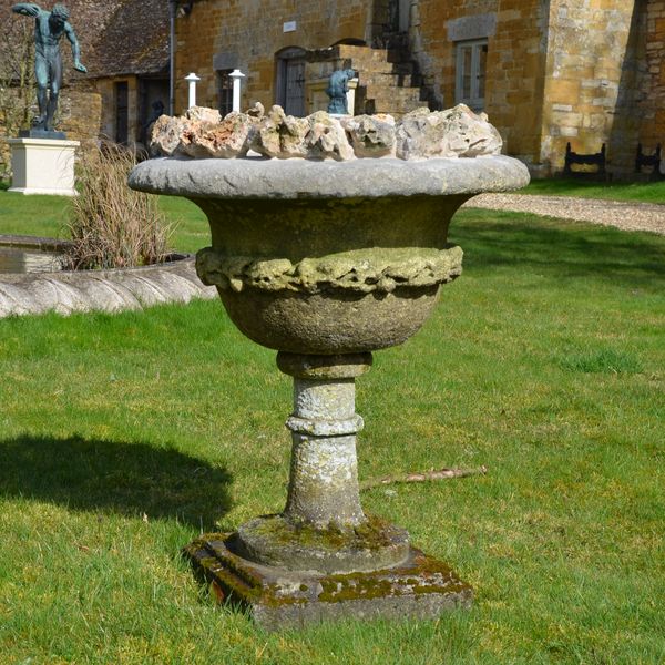 A late 19th century carved stone urn of campana form