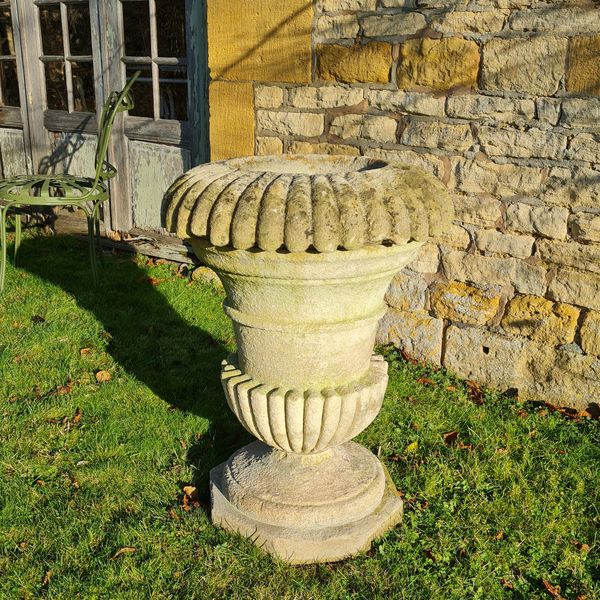 A large Cotswold Stone campana shaped planter