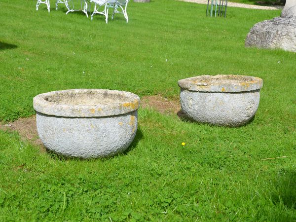 A pair of 19th century circular stone garden planters