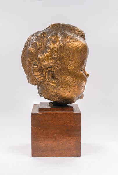 A gilt bronze baby portrait of Kirston Henderson 