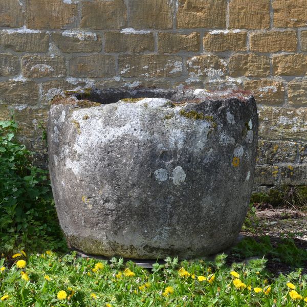 An 18th century circular stone trough