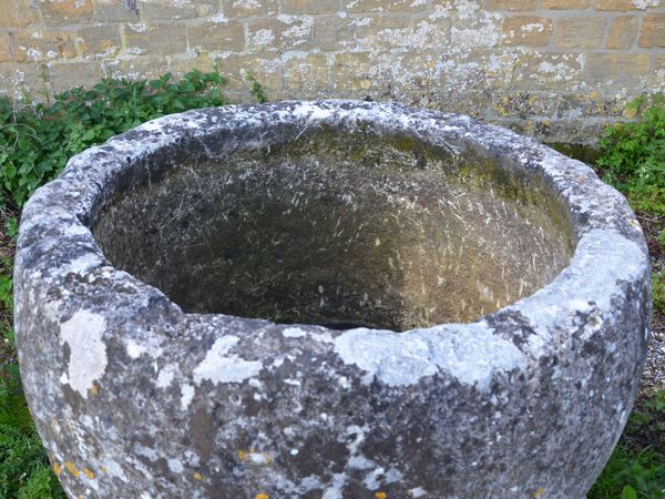 An 18th century circular stone trough