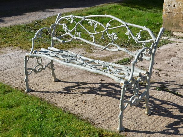 A 19th century cast iron garden seat of twig and foliage design