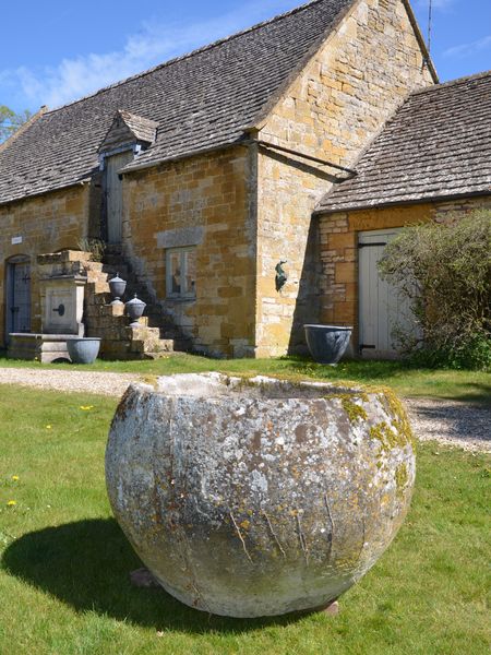 An 18th century large circular stone trough