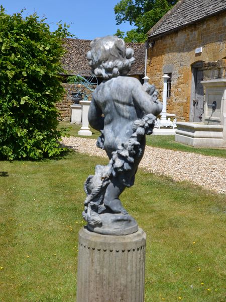 An early 20th century lead figure depicting Summer