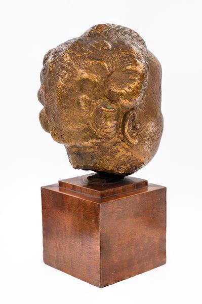 A gilt bronze baby portrait of Kirston Henderson 