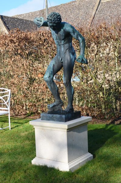 A pair of Italian 19th century bronze statues of The Dancing Faun and The Apollino after the antique