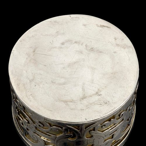 A circular strapwork Box, silver and parcel gilt, Dutch c.1660