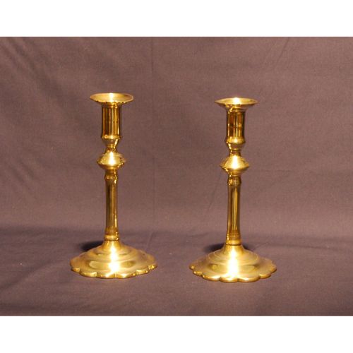 Pair of George II petal based Brass Candlesticks