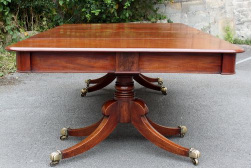 Regency twin pillar mahogany dining table