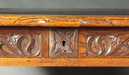Neo-Gothic carved oak writing table