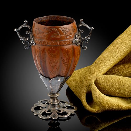A Spanish Colonial silver mounted Cocquilla nut goblet engraved with flowering tendrils