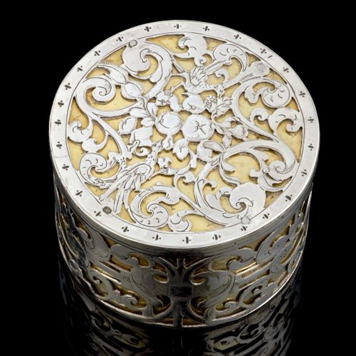 A circular strapwork Box, silver and parcel gilt, Dutch c.1660