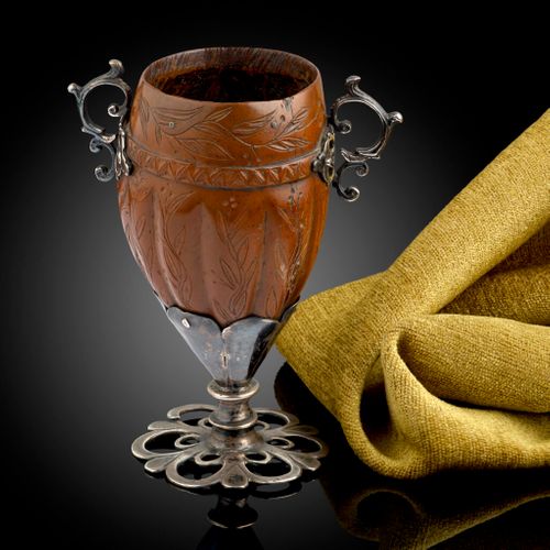 A Spanish Colonial silver mounted Cocquilla nut goblet engraved with flowering tendrils