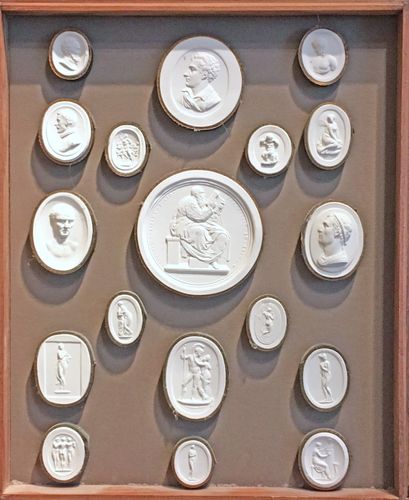 A framed & boxed collection of 61 intaglios / plaster medallions