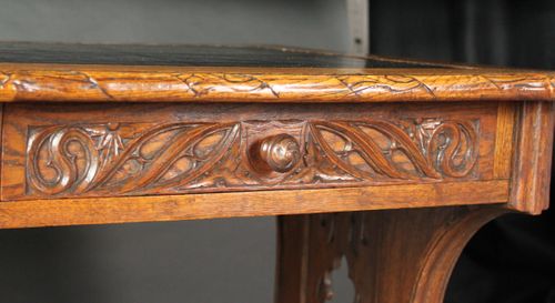 Neo-Gothic carved oak writing table