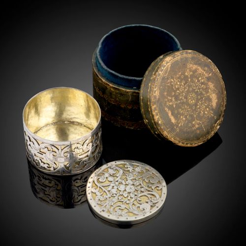 A circular strapwork Box, silver and parcel gilt, Dutch c.1660