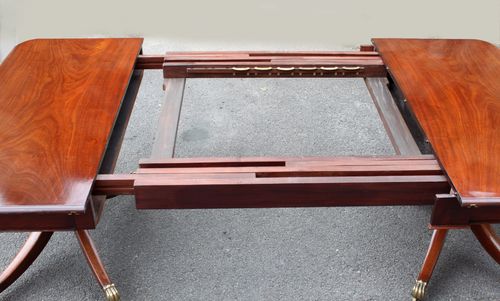 Regency twin pillar mahogany dining table