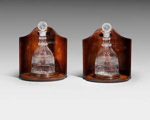 Pair of cut glass decanters and wooden coasters 