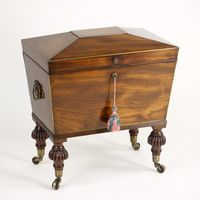 Small Regency mahogany sarcophagus shaped Cellarette 